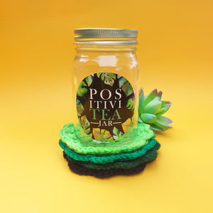 "PositiviTEA" jar with crochet coasters - black/greens