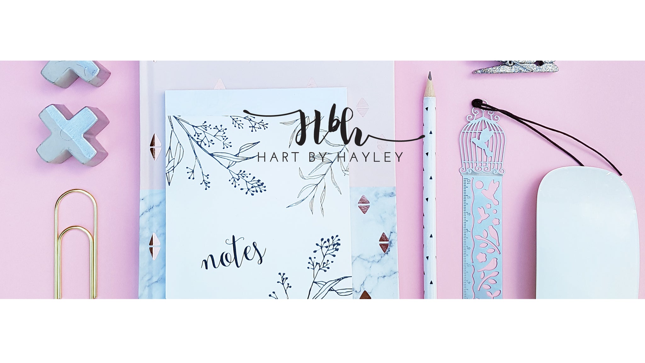 Pink desk banner with white & gold accessories.